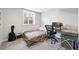 Cozy bedroom features neutral walls, plush carpet, and natural light from a window at 11041 Newland St, Westminster, CO 80020