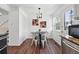 Cozy dining area featuring modern lighting, comfortable seating, and seamless access to the kitchen at 11041 Newland St, Westminster, CO 80020