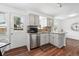 Well-lit kitchen with stainless steel appliances, granite countertops, and easy access to the outdoors at 11041 Newland St, Westminster, CO 80020