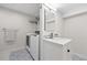 Functional laundry room featuring modern appliances and stylish patterned flooring at 11041 Newland St, Westminster, CO 80020