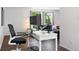 Bright living area with a dedicated workspace and ample natural light, perfect for remote work at 11041 Newland St, Westminster, CO 80020
