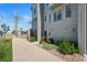 Townhome featuring modern design, large windows, and landscaped front yard along a sidewalk at 8711 E Hampden Ave # 6, Denver, CO 80231