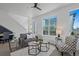Bright living room features modern furniture, neutral color palette, and natural light from large windows at 8711 E Hampden Ave # 6, Denver, CO 80231