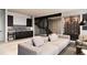 Finished basement with wet bar, cozy seating area, and stylish wine storage at 5052 Nile Ct, Golden, CO 80403