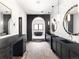 Luxurious bathroom featuring dual vanities, a soaking tub, and modern fixtures at 5052 Nile Ct, Golden, CO 80403