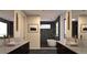Modern bathroom with dual vanities, soaking tub, and sleek finishes at 5052 Nile Ct, Golden, CO 80403