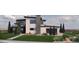 Stunning modern home with clean lines, mixed materials, and a well-maintained lawn at 5052 Nile Ct, Golden, CO 80403