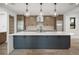Modern kitchen featuring a large island, stainless steel appliances, and pendant lighting at 5052 Nile Ct, Golden, CO 80403