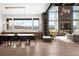 Open-concept living space with dining area, large windows with views, and modern decor at 5052 Nile Ct, Golden, CO 80403