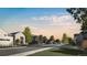 Scenic street view featuring modern architectural homes with trees and grassy lawns in a tranquil community at 5052 Nile Ct, Golden, CO 80403