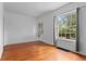 Bright bedroom features hardwood floors, large window and a fresh, neutral color palette at 1038 E 4Th Ave, Denver, CO 80218