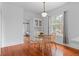 Inviting dining area featuring hardwood floors, a glass table, and built-in hutch at 1038 E 4Th Ave, Denver, CO 80218