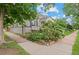 Beautifully landscaped property with lush greenery, showcasing the home's inviting curb appeal and serene surroundings at 1038 E 4Th Ave, Denver, CO 80218