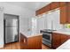 Bright kitchen featuring stainless steel appliances, center island, and hardwood floors, creating a stylish and functional space at 1038 E 4Th Ave, Denver, CO 80218
