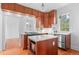 Bright kitchen featuring stainless steel appliances, center island, and hardwood floors, creating a stylish and functional space at 1038 E 4Th Ave, Denver, CO 80218