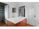 Modern kitchen features white quartz island, stainless appliances and hardwood floors, creating a functional space at 1038 E 4Th Ave, Denver, CO 80218