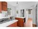 Bright kitchen featuring stainless steel appliances, center island, and hardwood floors, creating a stylish and functional space at 1038 E 4Th Ave, Denver, CO 80218