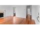 Open living room with hardwood floors and decorative fireplace at 1038 E 4Th Ave, Denver, CO 80218