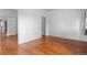 Bright living room featuring hardwood floors and multiple open doorways at 1038 E 4Th Ave, Denver, CO 80218