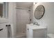 Modern bathroom featuring tiled shower with glass doors and updated fixtures at 116 Monarch St, Louisville, CO 80027
