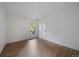 Unfurnished bedroom with hardwood floors, white walls, and a bright window at 116 Monarch St, Louisville, CO 80027