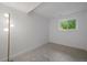 Bright bedroom with soft carpet and a large window at 116 Monarch St, Louisville, CO 80027