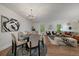 View of the dining area and living space with windows providing natural light at 116 Monarch St, Louisville, CO 80027