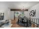 Dining area with modern lighting and ample seating, seamlessly connected to the updated kitchen at 116 Monarch St, Louisville, CO 80027