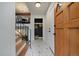 Welcoming entryway features modern geometric tile flooring and a convenient coat closet for storage at 116 Monarch St, Louisville, CO 80027