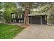 Well-maintained home featuring a two-car garage and manicured lawn, exuding suburban charm at 116 Monarch St, Louisville, CO 80027