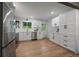 Well-lit kitchen with stainless steel appliances, plentiful cabinetry, and a functional layout at 116 Monarch St, Louisville, CO 80027