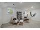 Bright living room features neutral decor and cozy seating area at 116 Monarch St, Louisville, CO 80027