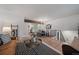 Open-concept living space features hardwood floors and seamless flow between the living, dining, and kitchen areas at 116 Monarch St, Louisville, CO 80027