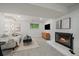 Cozy basement living room with a brick fireplace and comfortable seating at 116 Monarch St, Louisville, CO 80027