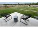 Well-manicured backyard featuring lush green grass and modern outdoor seating at 6736 S Flanders Ct, Aurora, CO 80016