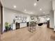 Spacious finished basement with kitchenette, bar seating, and exercise area at 6736 S Flanders Ct, Aurora, CO 80016