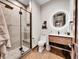 Modern bathroom featuring glass-enclosed shower, stylish vanity, and neutral colors at 6736 S Flanders Ct, Aurora, CO 80016