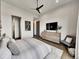 Serene bedroom with a modern ceiling fan, comfortable bed, and stylish furnishings at 6736 S Flanders Ct, Aurora, CO 80016