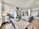 Bright, open dining area flowing into the kitchen and living room offers inviting and modern living at 6736 S Flanders Ct, Aurora, CO 80016