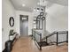 Modern entryway with high ceilings, a black and wood staircase, and an outdoor view at 6736 S Flanders Ct, Aurora, CO 80016