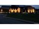 Elegant home exterior illuminated at dusk, showcasing the architectural details at 6736 S Flanders Ct, Aurora, CO 80016