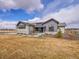 Beautiful single Gathering home with a stone and blue painted facade and nice yard at 6736 S Flanders Ct, Aurora, CO 80016