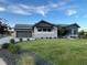 Beautifully landscaped front yard of a home with stone accents and a well-manicured lawn at 6736 S Flanders Ct, Aurora, CO 80016
