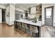 Modern kitchen with a spacious island, stainless steel appliances, and sleek gray cabinetry at 6736 S Flanders Ct, Aurora, CO 80016