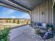 Inviting covered patio with stylish outdoor furniture and scenic views at 6736 S Flanders Ct, Aurora, CO 80016