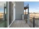 Private deck with views of surrounding community and distant hills at 3109 W Bates Ave, Denver, CO 80236