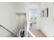 Bright hallway with carpet and door to bedroom with view at 3109 W Bates Ave, Denver, CO 80236