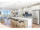 Open concept kitchen boasts a large island and modern finishes at 3109 W Bates Ave, Denver, CO 80236