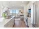 Modern kitchen with stainless steel appliances and an island at 3109 W Bates Ave, Denver, CO 80236