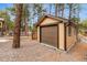 A detached garage offers extra storage, with easy access, blending functionality with nature at 731 Weston Rd, Larkspur, CO 80118